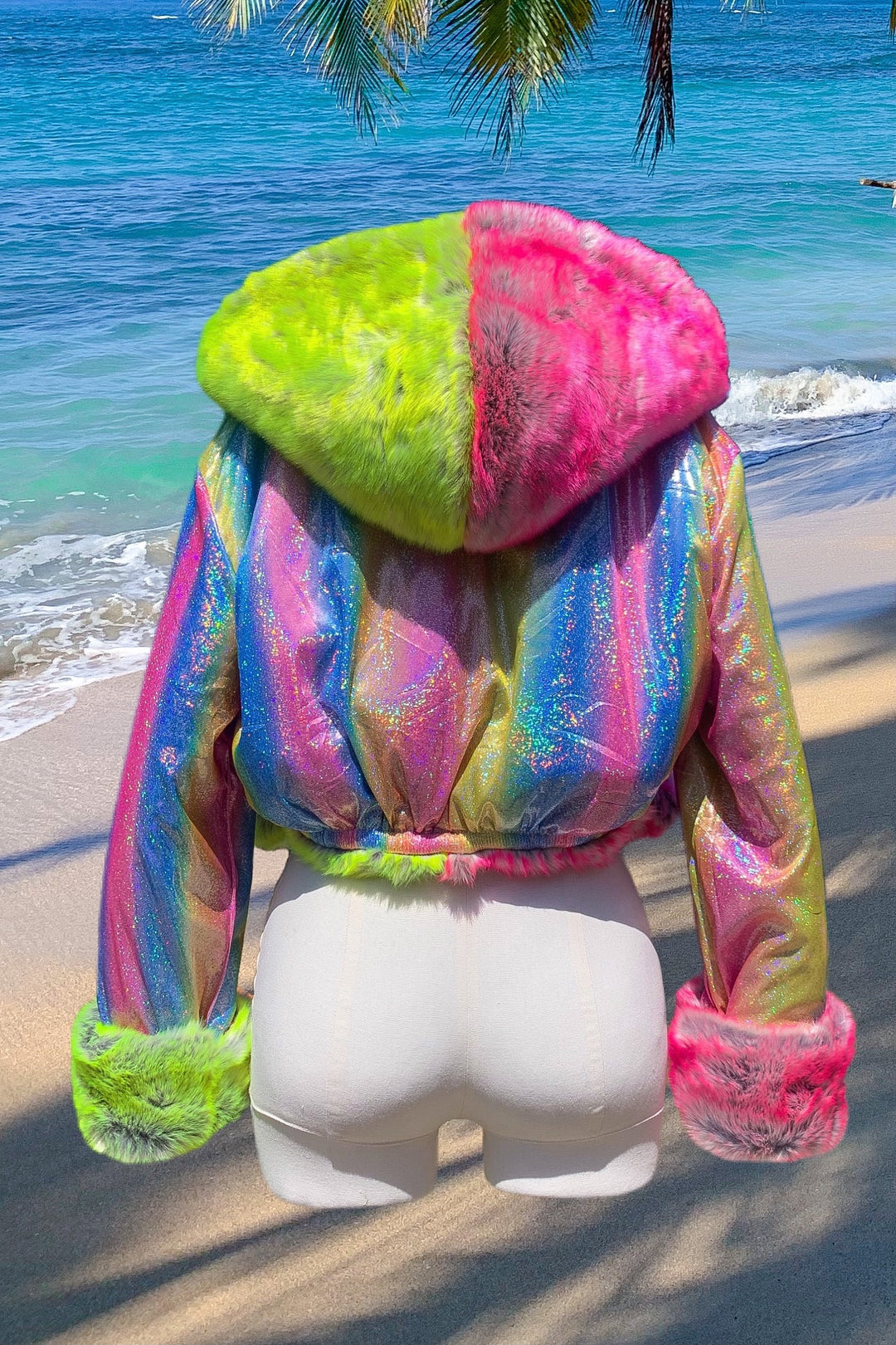 Colorful neon pink and green cropped faux fur coat with hood by Space Island.  Spvce Island is a wearable art collective featuring festival fashion, rave wear, club wear and streetwear. Buy coats, jackets, platform boots, gogo boots, rainbow platform sneakers, holographic sandals, shoes, burning man goggles, crystal chokers, holographic corsets, joggers, rave bottoms, bikinis, harnesses, bondage and more. 