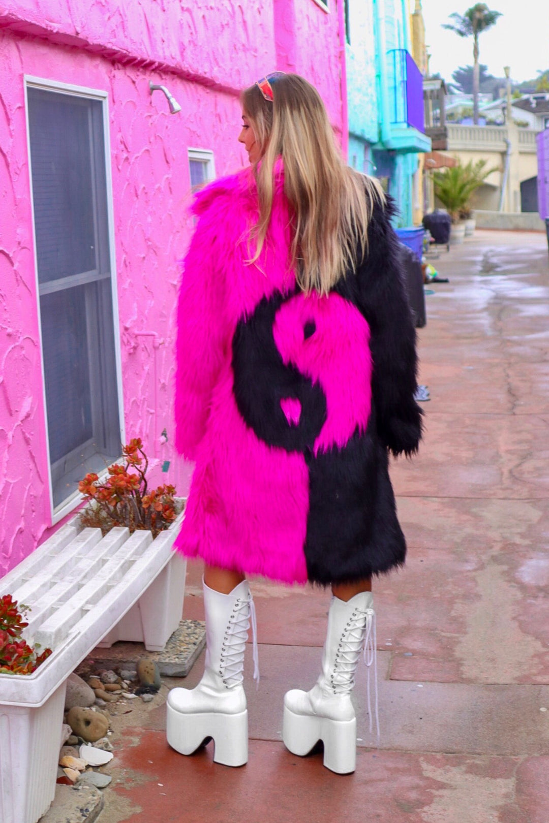 Yin Yang coat black and pink faux fur by Space island. Shop area 51 alien face coat, Yin yang black and white coats, rainbow neon fur coats. Spvce Island is a wearable art collective featuring festival fashion, rave wear, club wear and streetwear. Buy coats, jackets, platform boots, gogo boots, rainbow platform sneakers, holographic sandals, shoes, burning man goggles, crystal chokers, holographic corsets, joggers, rave bottoms, bikinis, harnesses, bondage and more.  